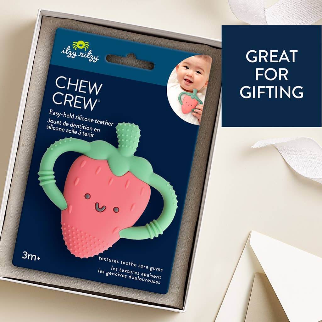 Strawberry Chew Crew Teether by Itzy Ritzy in packaging with handles and textured surface for soothing baby's gums. Great for gifting.