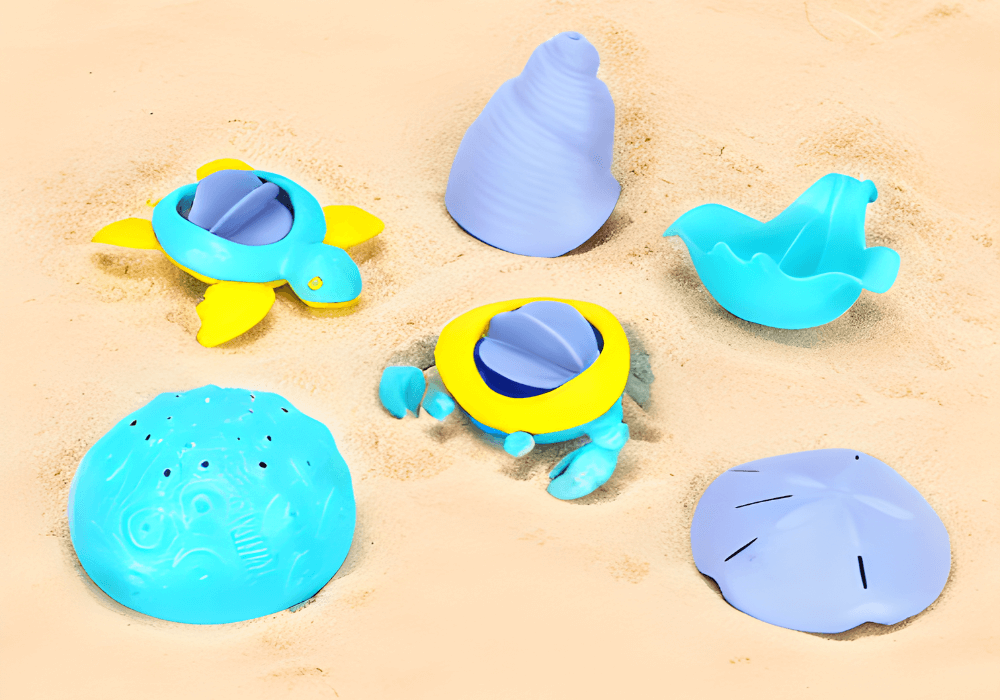Sea Life Play Set water toys including turtle, shell, crab, and various pourers on sand, ideal for bath, pool, and beach fun.